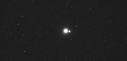 Earth and Moon from Mercury as imaged by the robotic spacecraft Messenger